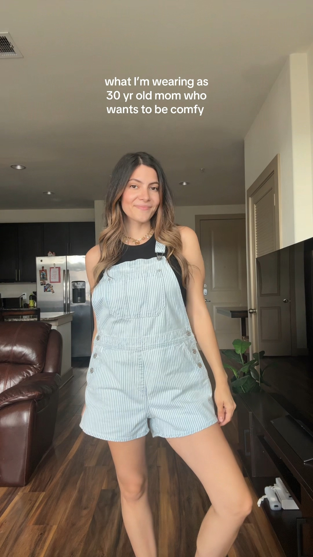 Size small in overalls & tank top


Stripped overalls, white converse high tops 