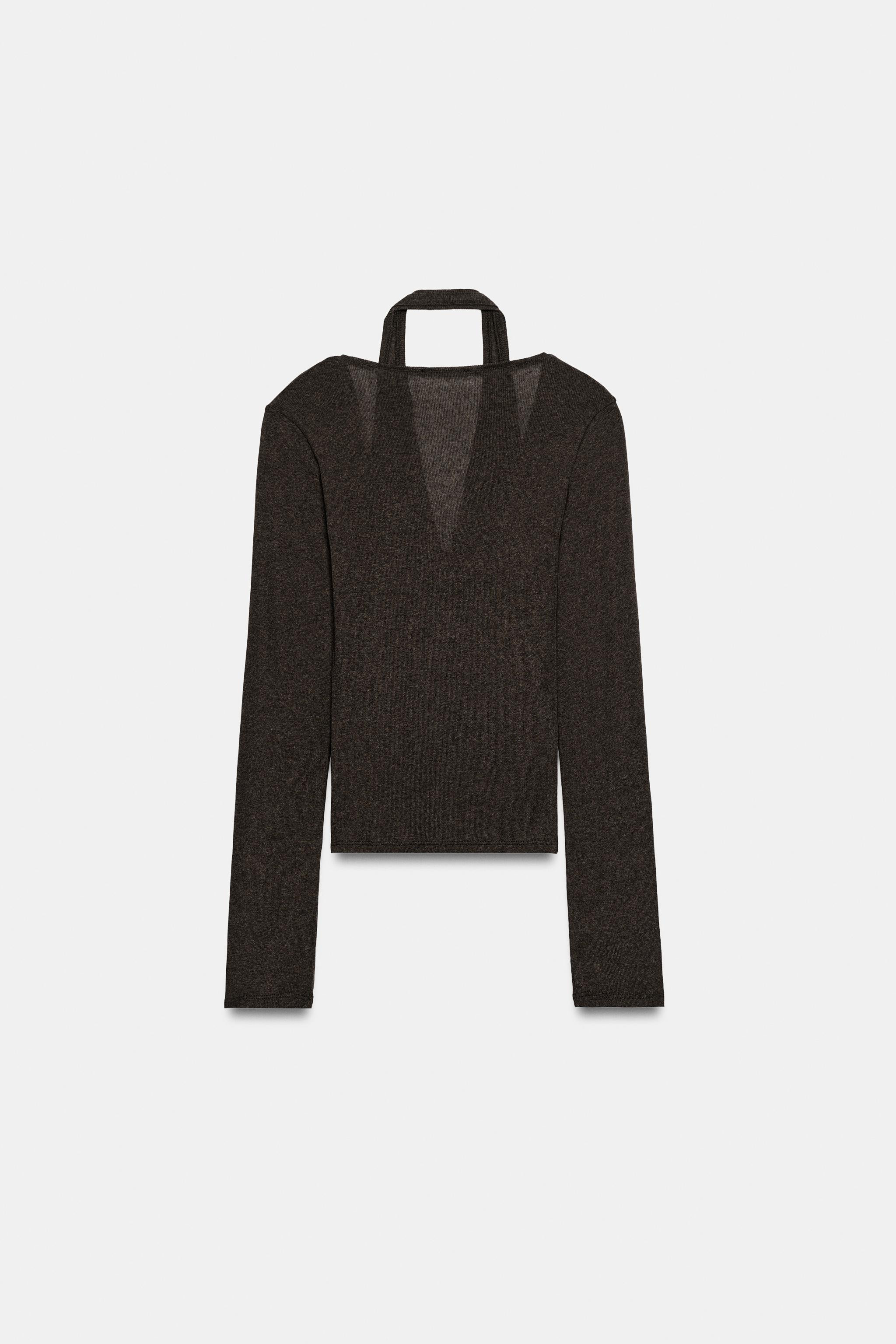 Model height: 173 cmV-neck top with long sleeves. Featuring an inner halter top with a double eff... | Zara UK