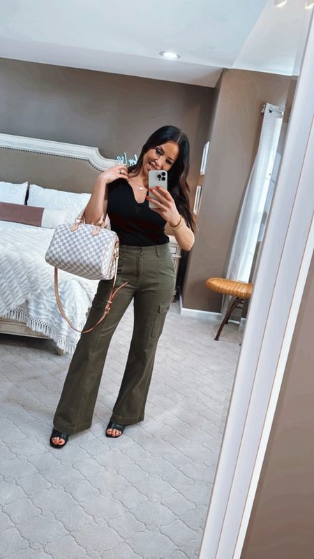 Seriously! When is the last time you thought of that name? But I promise you will LOVE these cargo pants! They have a great fit and some stretch to them. I also love this whole spring outfit with the polo sweater and LV dupe bag! Everything is affordable and sold at Walmart! 🖤🖤🖤🖤🖤🖤🖤

#LTKfindsunder50 #LTKstyletip #LTKover40