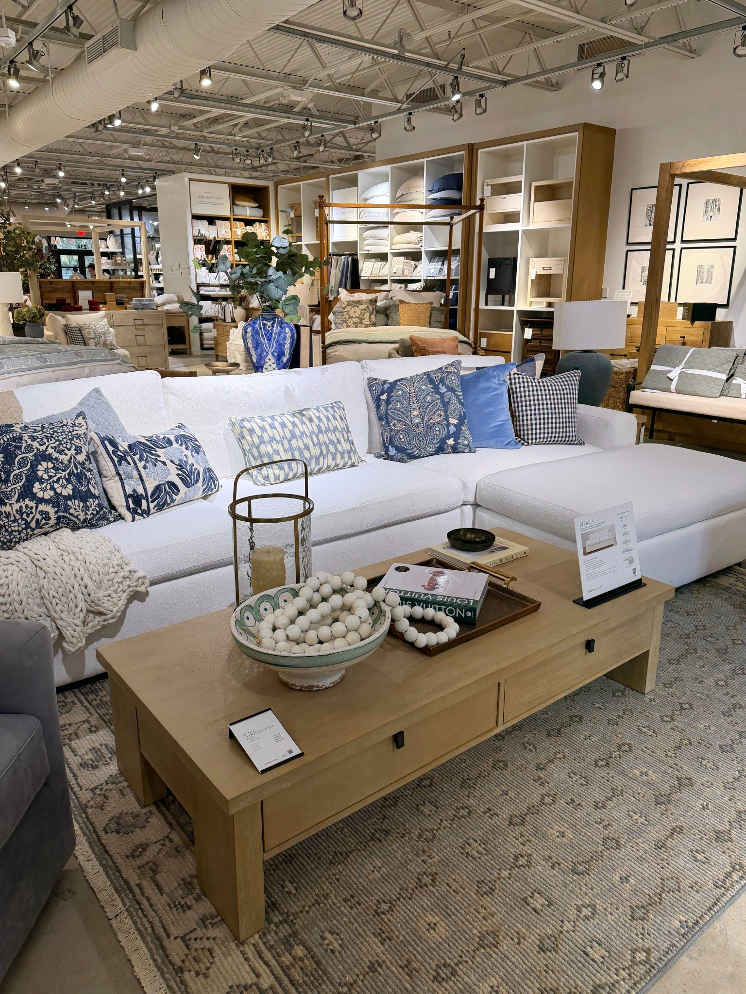 Pottery Barn living room inspo! 🤍 This cozy neutral space is layered with soft textures and pops of blue accents for a fresh summer feel. 🌊 Featuring the White Sierra Sectional, Modern Farmhouse Rectangular Coffee Table, and the Lydia Hand-Knotted Wool Rug—a beautiful mix of classic pieces that create a warm, inviting living room. ☺️ Linked the whole look! 🙌🏻 #PotteryBarn #LivingRoomInspo #Sectional

#LTKSaleAlert #LTKHome