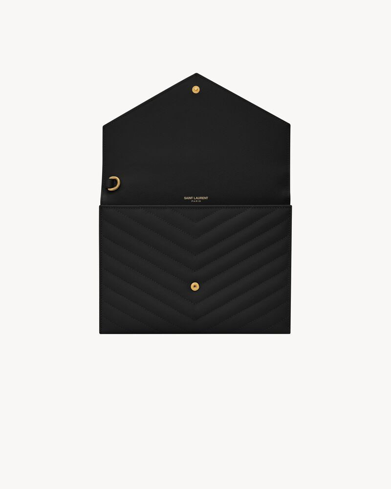 Monogram envelope clutch with a front flap made with metal-free tanned leather and organic cotton... | Saint Laurent Inc. (Global)
