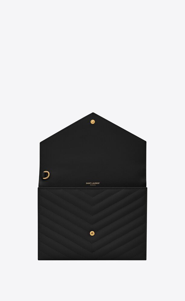 Monogram envelope clutch with a front flap made with metal-free tanned leather and organic cotton... | Saint Laurent Inc. (Global)
