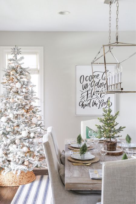 Our Christmas dining room from several years ago is still a favorite! Items include an oversized linear dining room light, faux flocked Christmas tree, distressed wood chargers, striped linen napkins and gold place setting. Other items include a blue and white striped rug, linen chairs and a large, antique wood dining room table. 

Target home decor, Target finds, christmas décor, amazon décor, christmas pillows, target christmas, dining room decor, family room décor, amazon home, amazon Christmas, amazon finds, pottery barn décor, #ltkfamily  #ltksale 

#LTKfindsunder50 #LTKfindsunder100 #LTKSeasonal #LTKhome #LTKsalealert #LTKstyletip #LTKSeasonal #LTKHoliday #LTKhome