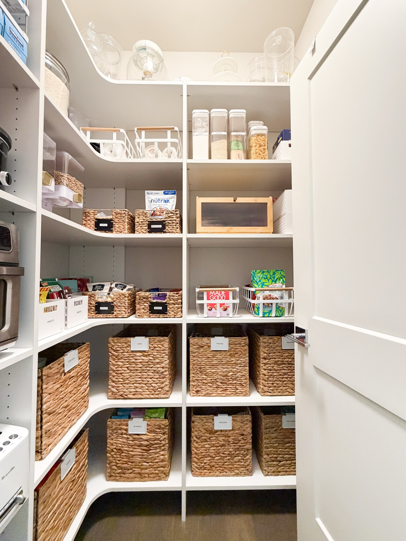 PANTRY ORGANIZATION! 🛒✨

This pantry was STRESSING me out! I finally took everything out, tossed so many expired items, and grouped everything by category. The best part is that I barely bought any new containers!

Here’s what I did differently:
• Low-profile baskets for small snacks: I can actually see everything now instead of digging through big baskets of random snacks.
• Less decanting: I had way too many jars, and transferring everything was extra work for items we barely used.
• Labeled everything: I never really labeled before, which made it way too easy to forget what we had.
• Ditched the rolling can rack: Cans in the back were always getting forgotten so now I use a behind-the-door organizer where I can see everything at once.

I LOVE how this pantry organization turned out, and I’m actually confident we can keep it this way! 🙌🏼 #pantryorganization #kitchenorganizationideas

Baskets, fruit basket, Bamboo bread box, foil and plastic wrap organizer, rice storage container, canister jar set, storage basket, food dispenser, over the door pantry organizer

#LTKsummer #LTKhome