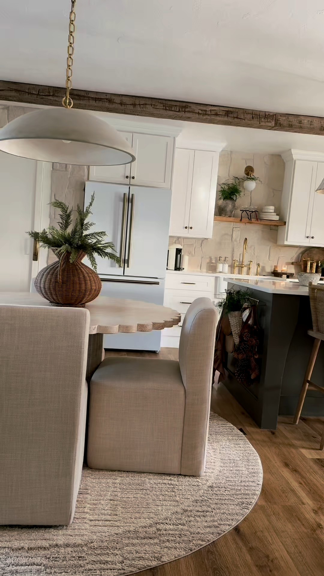 A subtle Christmas kitchen! My plant on the counter is real. The stems on my kitchen table come in a bundle of 3 and are real touch cedar and currently 30% off! A good staple to keep for all winter long! Stone is from floor and decor. Alamo sandstone random ledger panel. Alabaster grout! Barstools are from Oka. Taino counter stools. Kitchen design. Organic modern kitchen. Small dining room spaces  

#LTKHoliday #LTKSeasonal #LTKHome