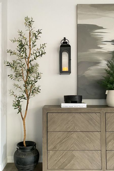 This 7’ tall faux olive tree is great for spaces of all sizes as it doesn’t take up a ton of floor space! 🙌 Tip: replace your Christmas tree with a faux tree to keep your space feeling fresh and green! 👌

#olivetree #fauxtree #greenery #plant 

#LTKhome #LTKstyletip