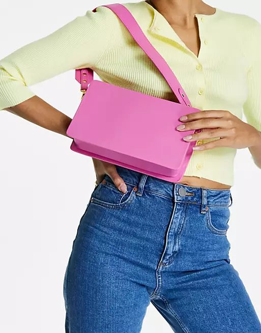 ASOS DESIGN elongated shoulder bag with wide strap in pink | ASOS (Global)