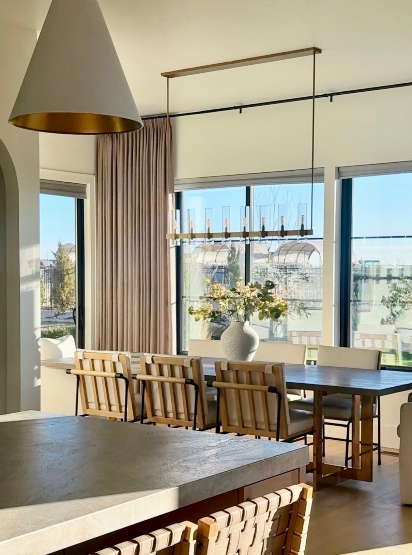 I’ve linked the dining chairs, chandelier, curtains, and a few of the finishing details that help this space feel warm and layered.

I love mixing natural wood tones, soft textiles, and timeless lighting to create a dining room that feels inviting every day. These are the pieces that bring warmth, texture, and a collected designer look without feeling overly formal.