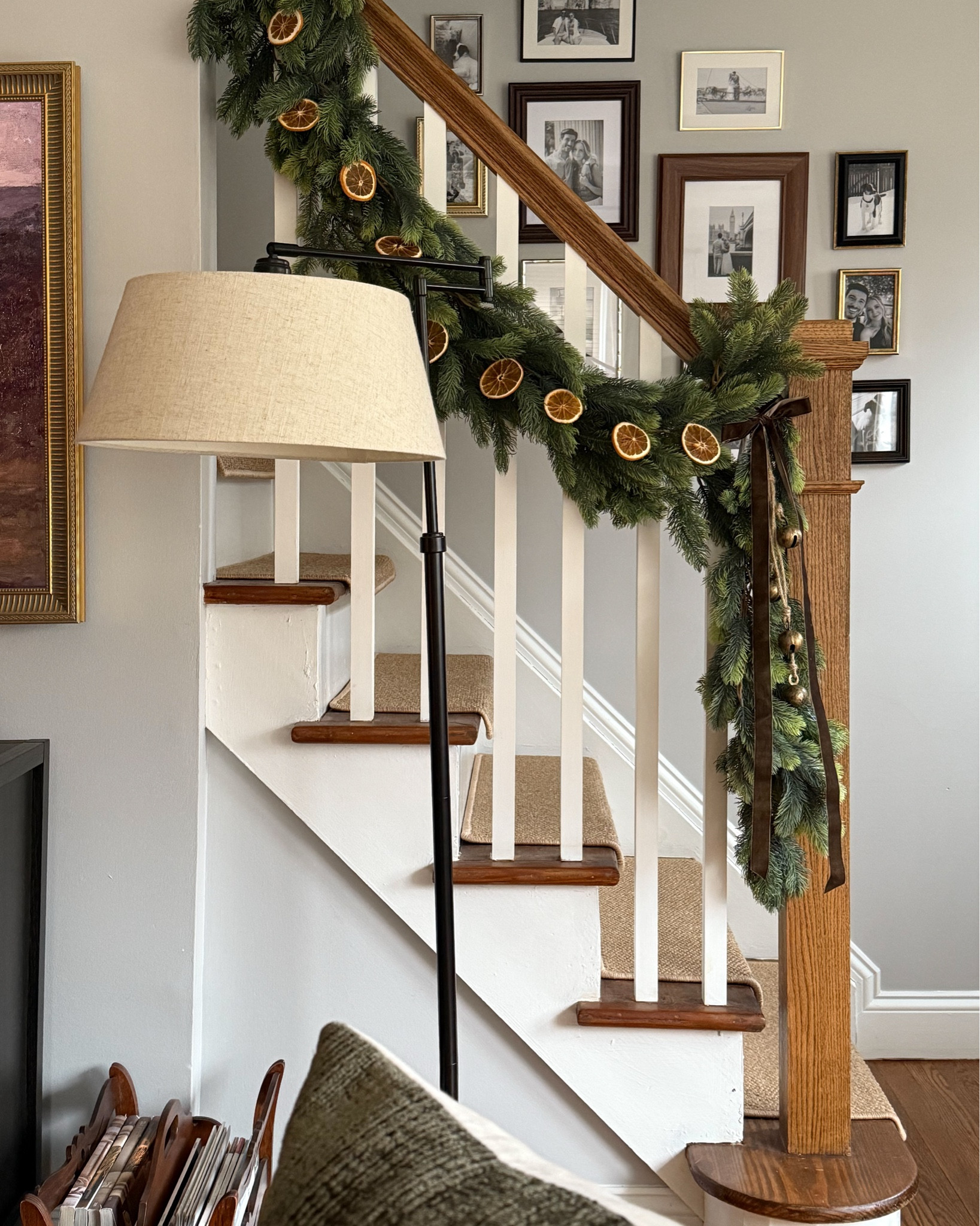 This year’s holiday garland for the banister — love adding bells, ribbon, and dried oranges for texture & dimension 🙌🏼 I used 3 of the Amazon garland wrapped together to make it even fuller and hung with a mix of command hooks, ribbon, and wire ornament hooks for the oranges.

#LTKSeasonal #LTKGiftGuide #LTKHoliday