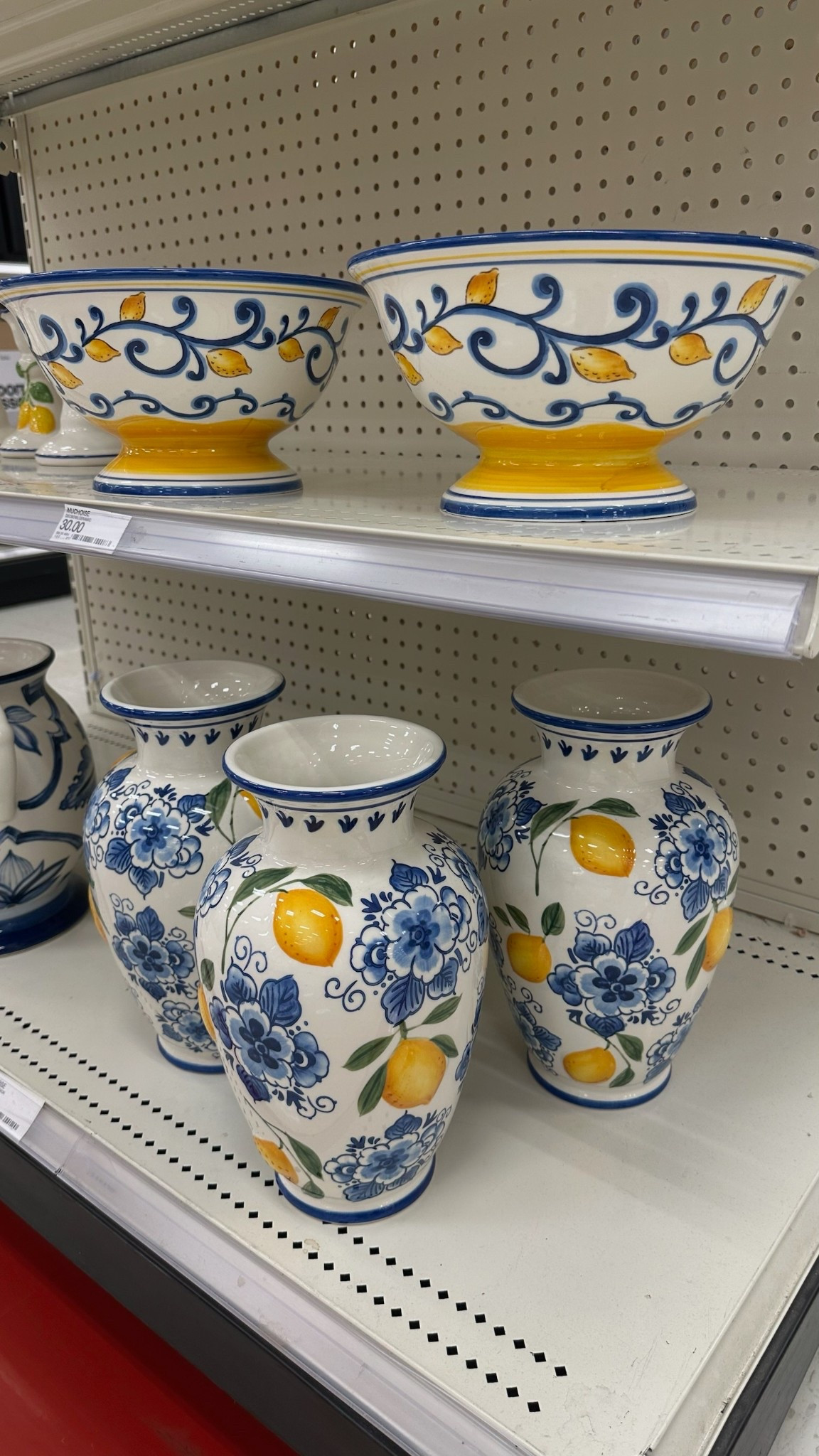 Target home find! Blue and white ceramic vases with a lemon motif that add the perfect pop of color. A beautiful option for kitchen counters, open shelving, or summer tablescapes. 

#LTKspringtrends #LTKHome #LTKspring