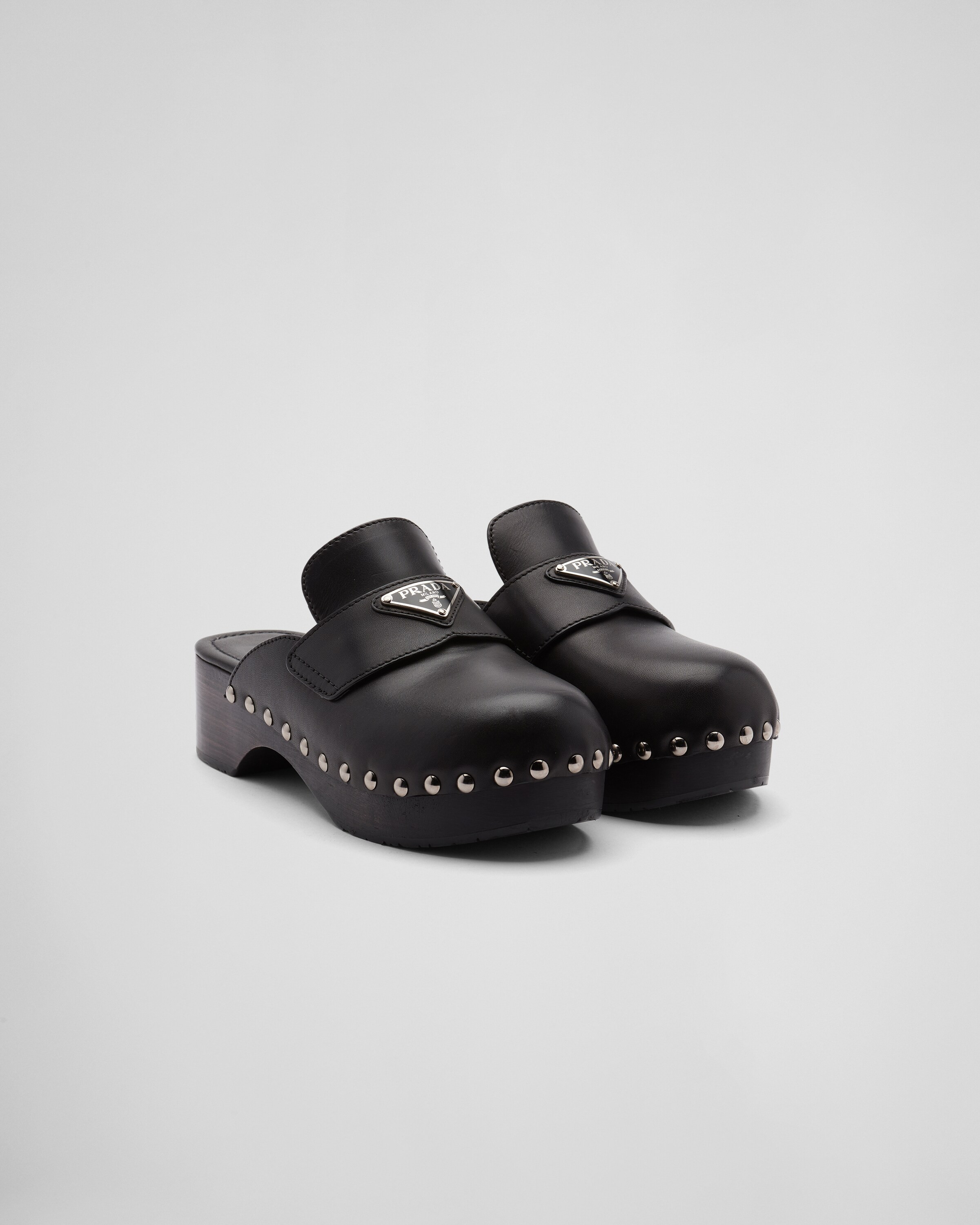 Studded leather clogs | Prada US