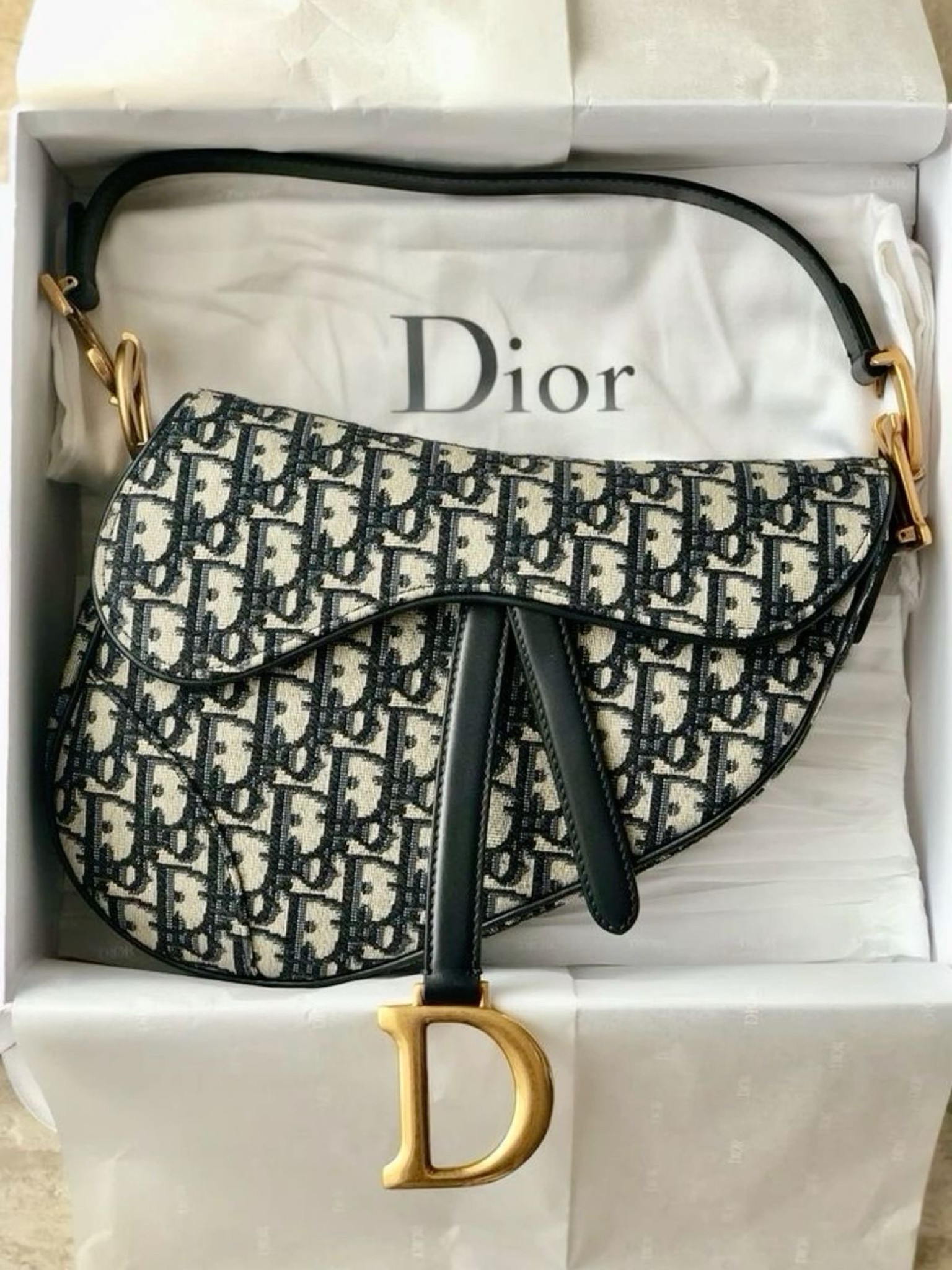 Elevate your everyday style with the iconic Dior Saddle Bag. Featuring the signature 'D' charm and timeless monogram, this versatile piece is a must-have for any wardrobe. Perfect for adding a touch of luxury to your daily look. Get yours now and experience the blend of elegance and functionality!

#LTKSeasonal #LTKItBag #LTKBacktoSchool