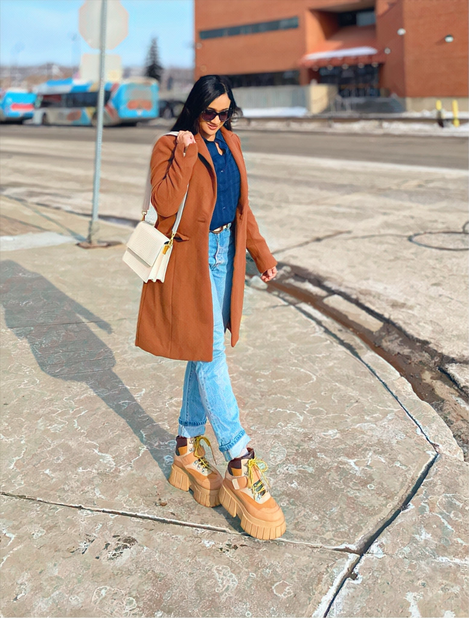 A chic spring outfit 
Skinny jeans, navy blue blouse, chunky combat boots, sling bag, sunnies 

#LTKworkwear #LTKSeasonal #LTKstyletip