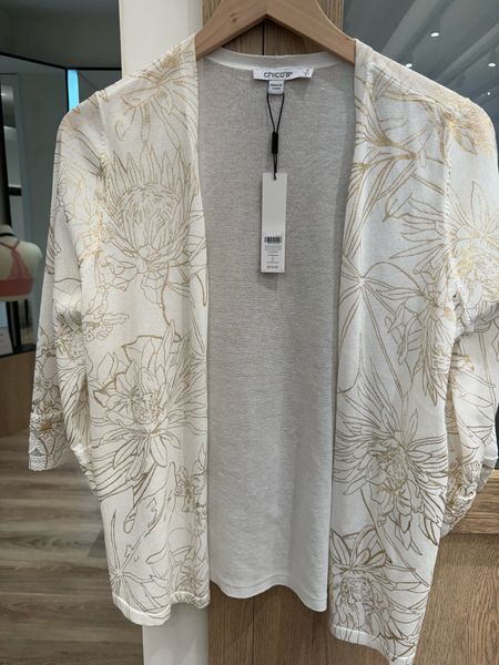 The Summer Romance Foil Printl Cardigan is the perfect weight for the warmer months. This cotton blend cardi features a dry, ultra lightweight hand feel with a subtle sheen, plus applied lace trim cuffs on the flare sleeve. Use this topper as the final accent over tanks and tees.