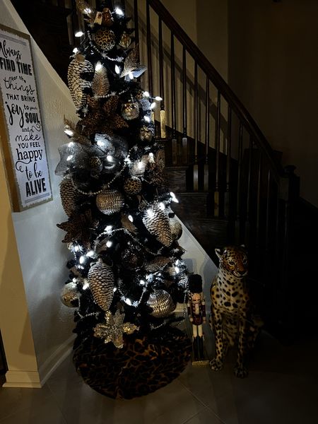 Dramatic Christmas TREE- YES PLEASE! 
Rawr leopard 🖤🧡🖤 

Pencil Trees are Great for Small Places and Corners! 

#LTKhome #LTKSeasonal #LTKHolidaySale