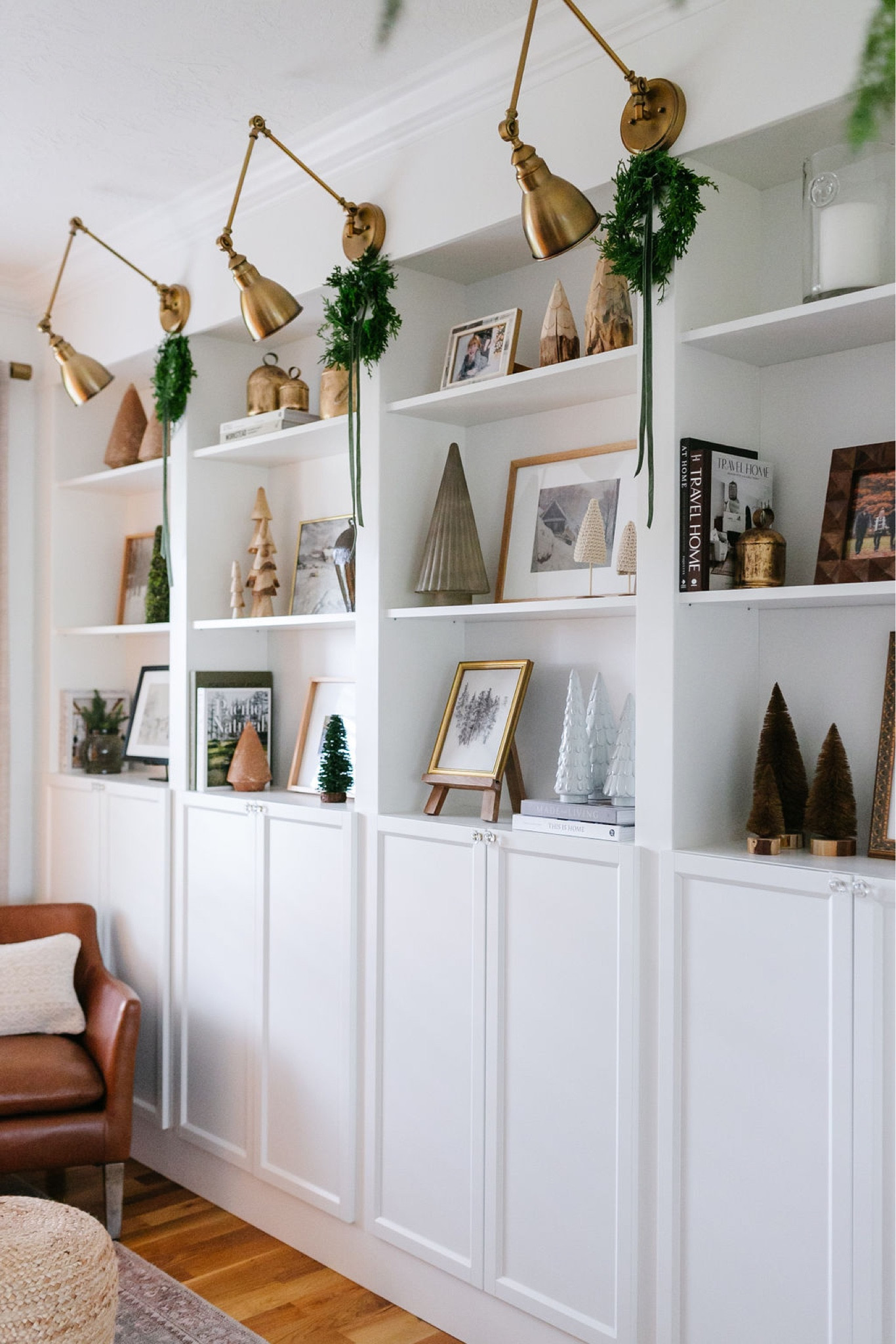 Christmas decor, holiday decor, faux trees, bookshelf decor, wreath, artwork, leather chair, brass sconce, shelf styling 

#LTKhome #LTKHoliday #LTKSeasonal
