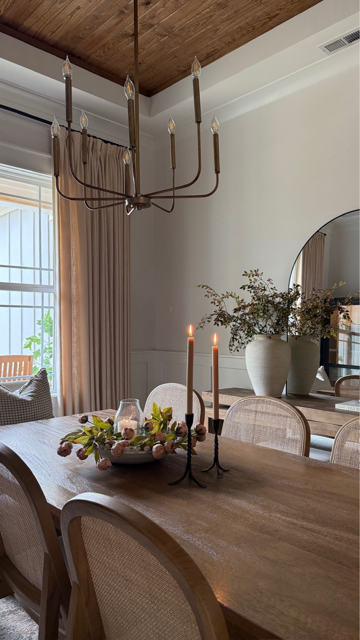 The prettiest view in our dining room 🤎 I love this floral centerpiece with taper candles. Such an elevated, yet simple way to decorate a dining room table. It’s my favorite place to gather in our cozy home. 😍

#LTKHome