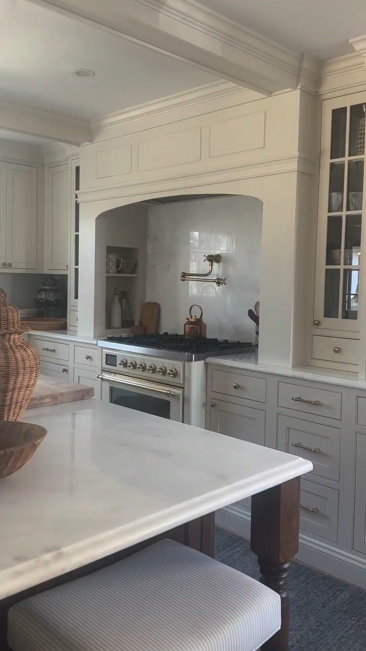 Choosing a creamy white can be crippling! I’m beyond thrilled with the variety of tones each paint color brings throughout the day. Sometimes a little butter yellow, sometimes straight cream, and sometimes a white feeling. All to bring layered, airy and light feels to the space! 

Here’s the exact lineup:

Cabinets: White Duck by SW is the color match to the Antique White factory finish by The Cabinet Joint. You will see the White Duck paint on the custom range alcove and beams. Seamless!

Walls: Cloud Cover by BM 

Trim: Pure White by SW

Comment SHOP for links and to read all about the space! 

#kitchenreno #kitchenpainting #whitepaint #creamypaint #cottagekitchen