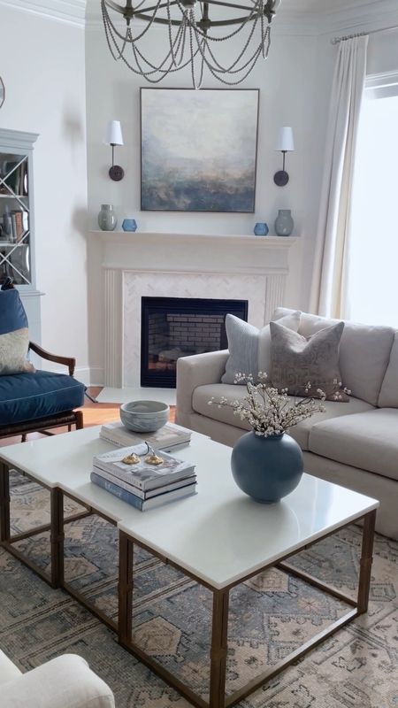 Porch Daydreamer family room. Check out this family friendly cleanable coffee table and low pile vintage look rug in blue and green   

#LTKhome #LTKVideo