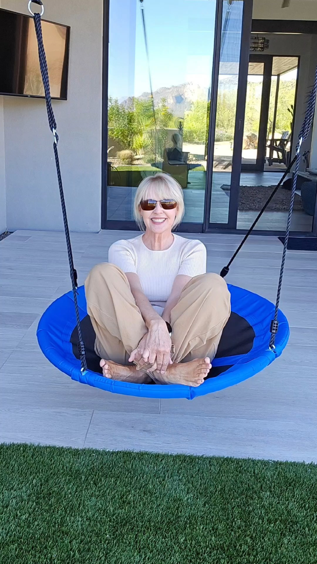 This saucer swing is fun for any age! I love that once it gets going, you can just sit back and enjoy the ride. The height is adjustable and you can hang it like it is here or attach at one point for a spinning swing. I bought it for my grandsons (for when they visit), but I'm having way too much fun on it! My cargo pants and top were a great deal on Amazon! 

#LTKFitness #LTKActive #LTKHome