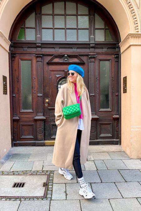 Green Bag. Fashion and Style Blog Girl from Heartfelt Hunt. Girl with blonde hair wearing a green bag, camel coat, blue beret, pink sweater, faux leather leggings in white socks and dad sneakers. #colorfuloutfit #colorfulstyle #colorfulfashion #colorfullooks #fashionfun #cutefalloutfit #fallfashion2022 #falllookbook #fitcheck #dailylooks #dailylookbook #contentcreator #microinfluencer #discoverunder20k