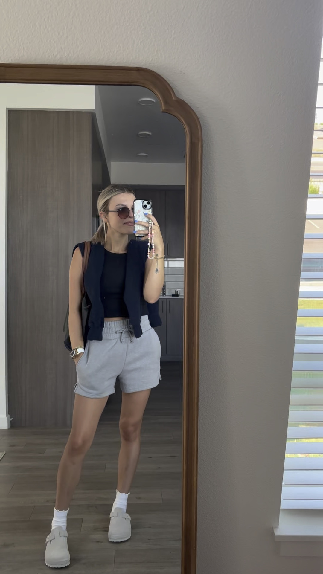 Plain black tank with my favorite target shorts, and Boston clog berks paired with my long champ bag 

#LTKtravel #LTKshoecrush #LTKstyletip