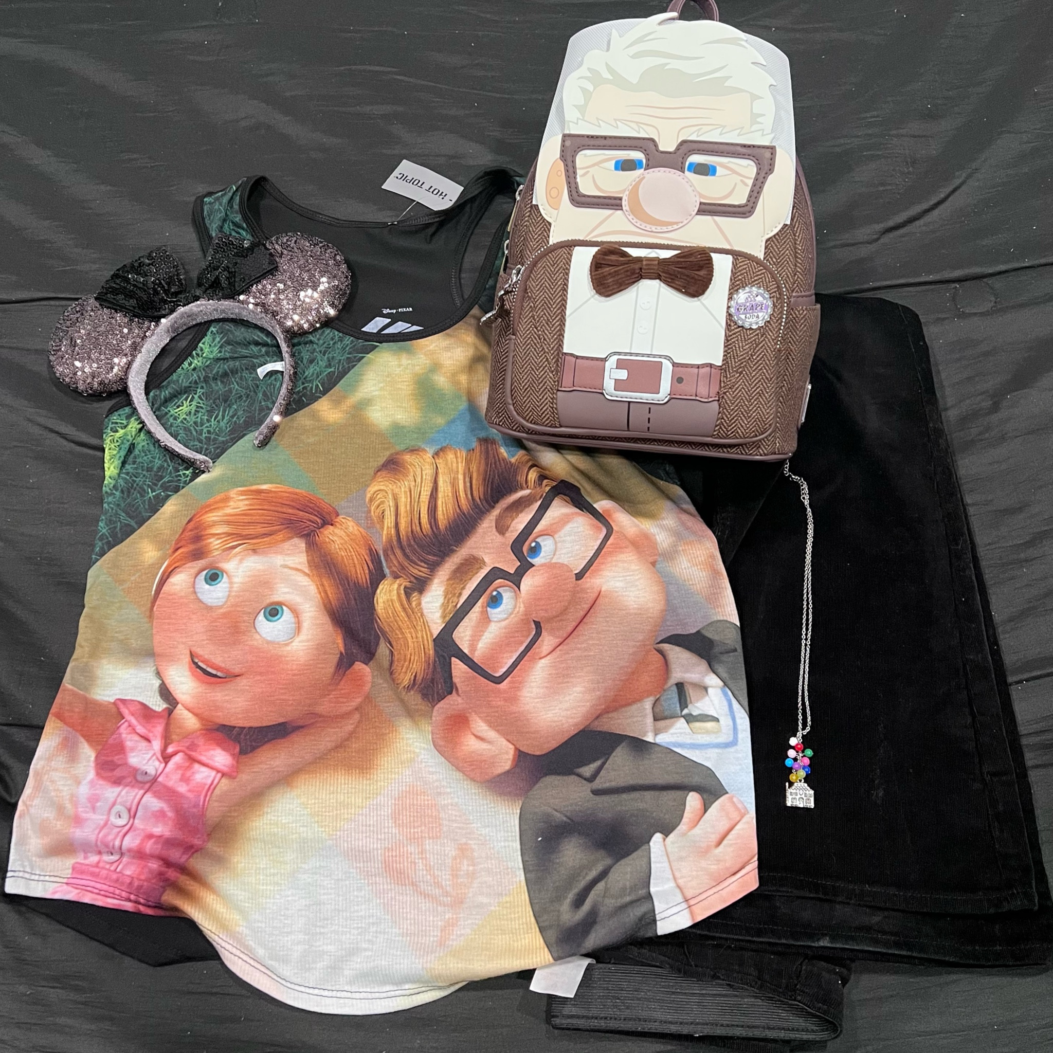 Disney OOTD.  

Carl Loungefly - sdcc 2022 exclusive 
Carl and Ellie tank - hot topic 
Corduroy pants - No Boundaries 
Ears - ShopDisney 
Up necklace - AliExpress

I have linked some similar items for those that are older and no longer available.  Cord pants are still at my local Walmart so check your store!

#LTKunder50 #LTKunder100 #LTKitbag