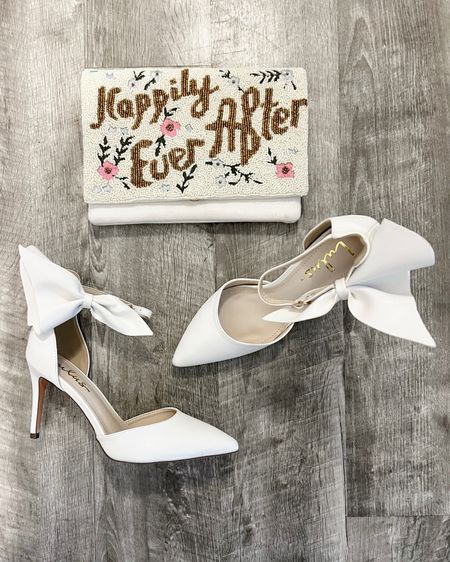 Wedding day details 👰🏼‍♀️

These white bow ankle strap pumps & ‘Happily Ever After’ clutch handbag are the perfect finishing touches for your bridal shower, bachelorette, & wedding day looks. 

#LTKwedding #LTKstyletip #LTKshoecrush