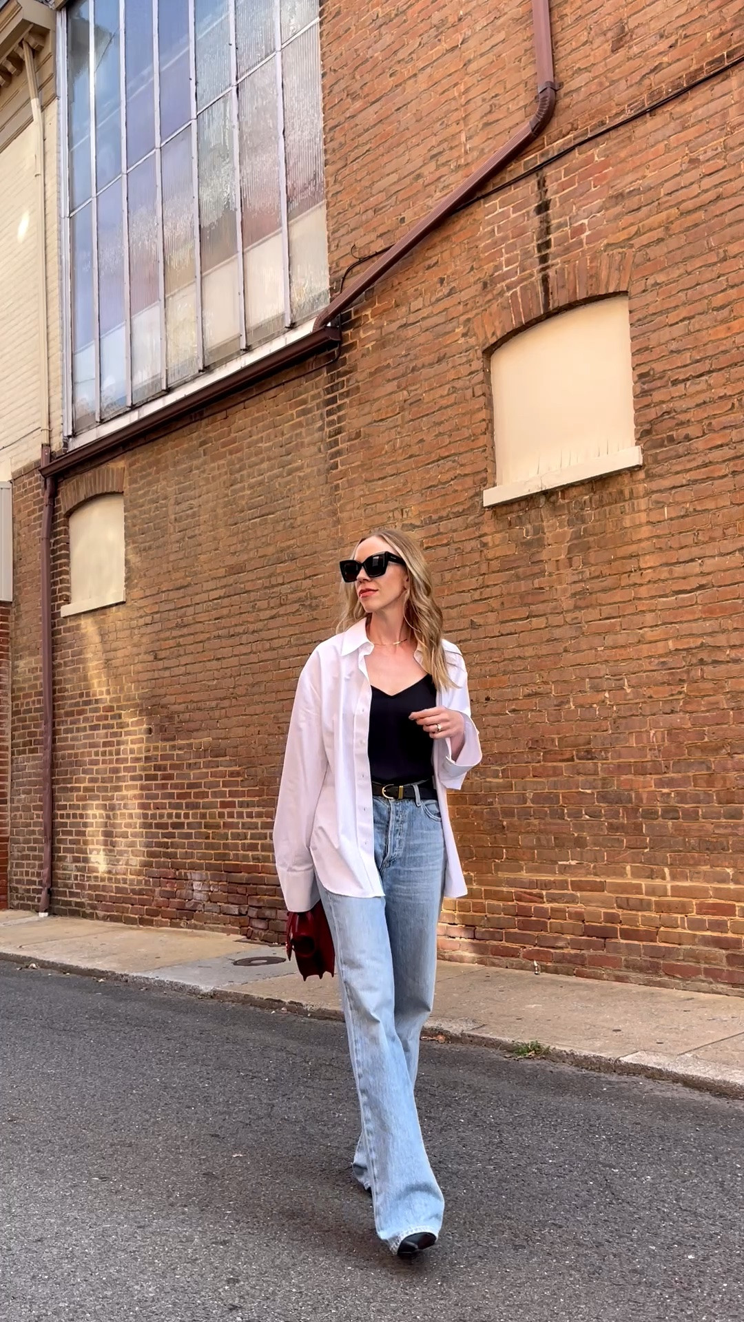 Transitional outfit idea for late summer and early fall, oversized button down worn over camisole with wide leg jeans

#LTKOver40 #LTKSeasonal #LTKSaleAlert