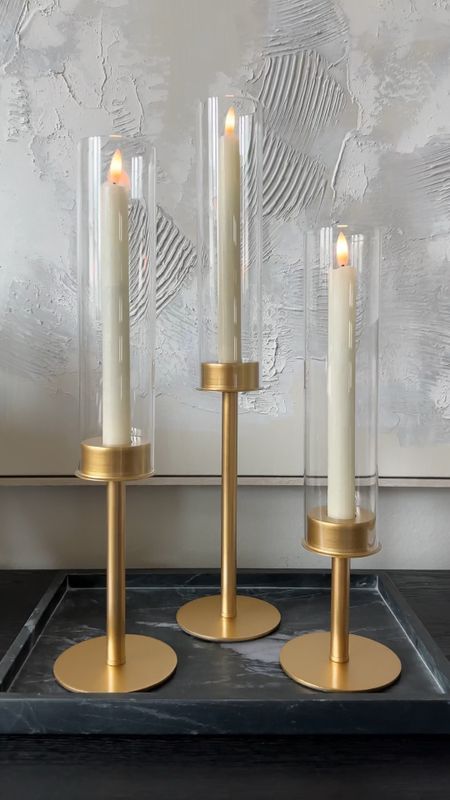These beautiful and unique taper candle holders look so much expensive than they really are! So chic and they’re a perfect addition to any vignette. I used flameless candles but you can use real ones too!! 

#LTKHome #LTKStyleTip #LTKVideo