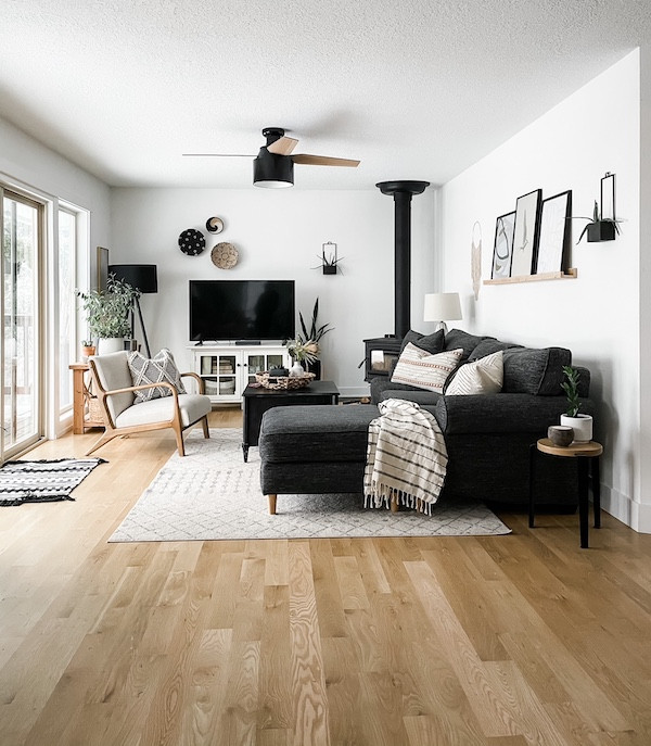 Neutral, cozy living room with dark gray charcoal, couch, and lots of layers. Perfect proportion & added height makes best use of the small space.

#LTKHome