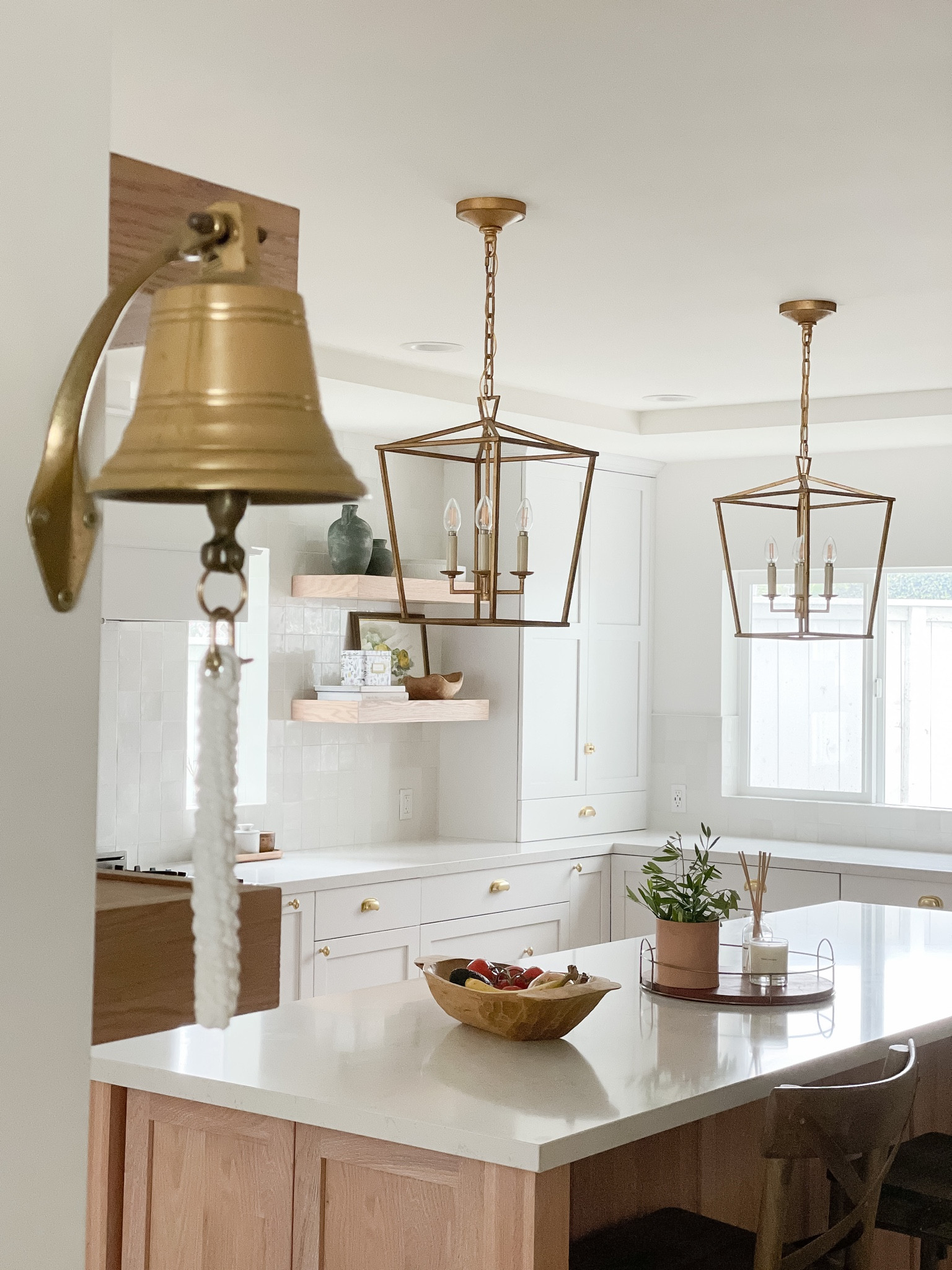 Kitchen island lighting and decor.

Vintage dough bowl and vintage bell from www.peonyandolive.com

#LTKhome