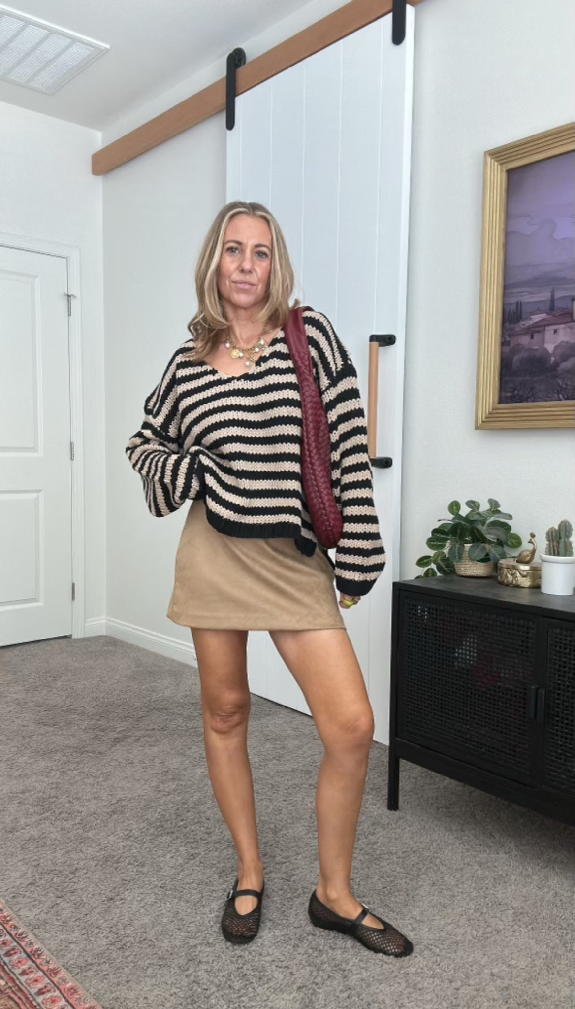 Loving this stripe sweater + suede skirt combo

#LTKStyleTip #LTKSeasonal
