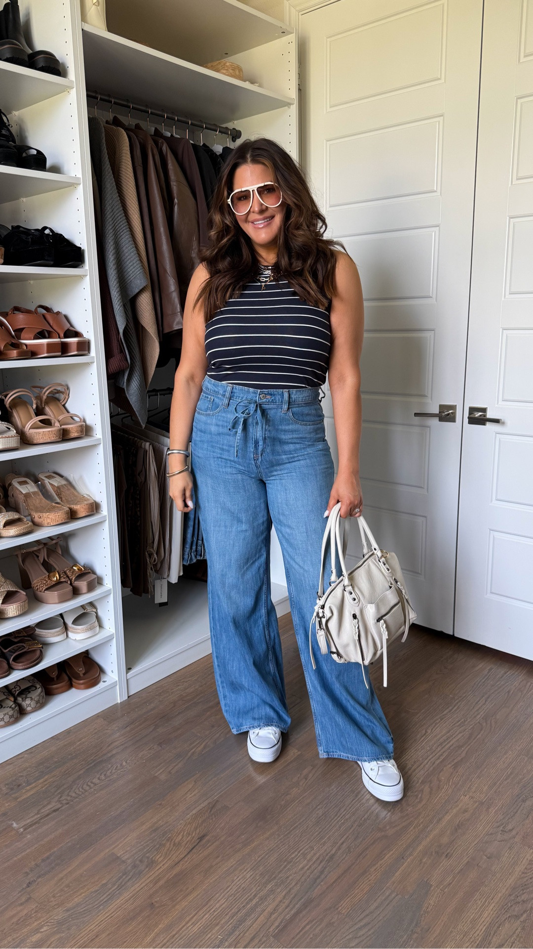If you’re looking for the perfect pair of wide leg jeans, these are IT. 🙌 The flattering high-rise fit, adjustable tie waist detail, and relaxed leg make them incredibly comfortable while still looking polished and put together. And this Amazon bag is identical to the Free People Emerson tote.

Jeans: 12 Long
Tank: Large

I paired them with the ultimate everyday tank top that’s soft, stretchy, and perfect for layering or wearing on its own all summer long. This is one of those easy outfits you’ll reach for on repeat—whether you’re running errands, heading to lunch, traveling, or just want to look effortlessly chic.

#WideLegJeans #MidsizeStyle #casualchicstyle #EverydayOutfit#FashionFinds

#LTKootd #LTKgrwm #LTKMidsize