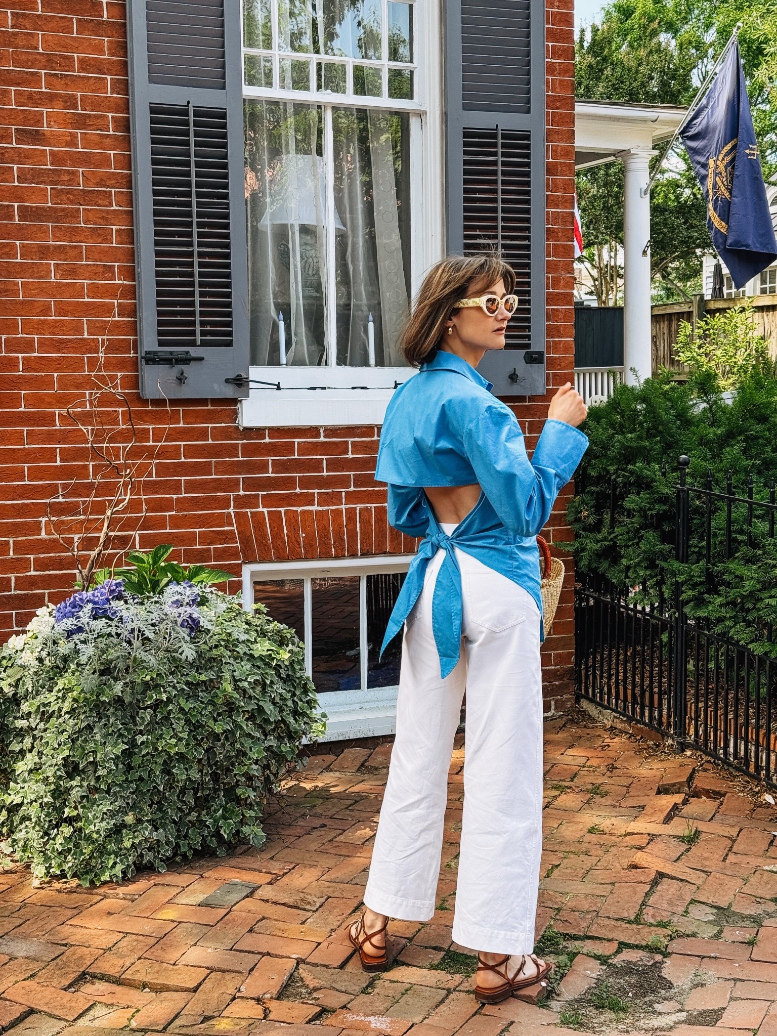 This blue open back shirt and white pants would be a perfect look for the 4th of July. 

#LTKTravel #LTKParties #LTKSeasonal