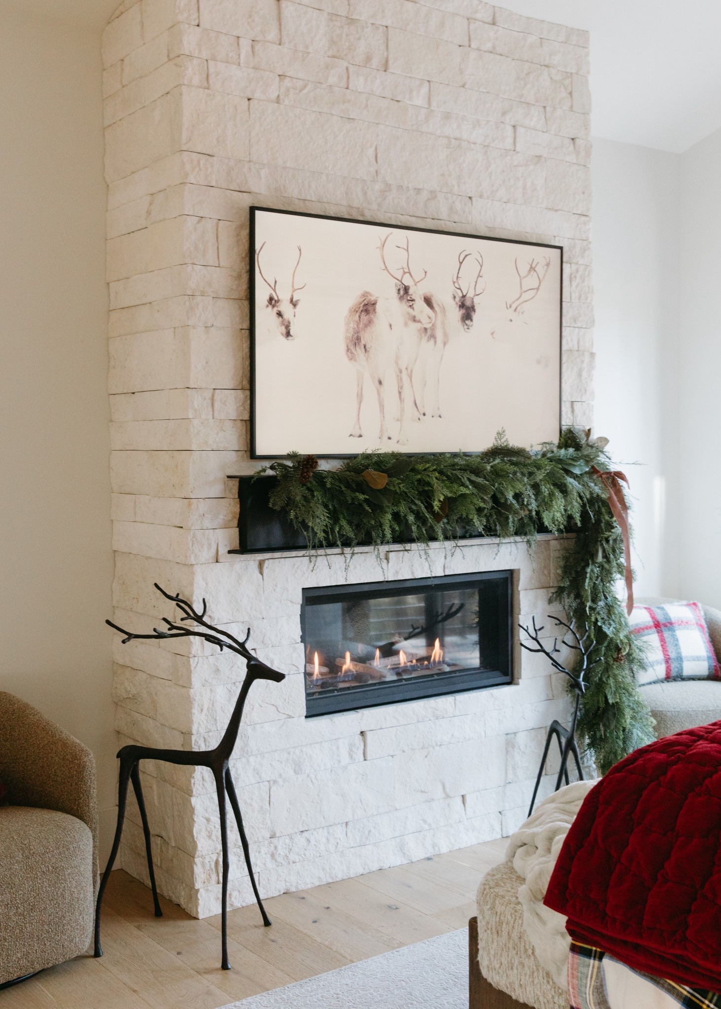 A cozy Christmas fireplace moment in the primary bedroom. The garland draped off to one side is so dramatic and I love it! The Stewart Plaid bedding and throw pillows really make it feel extra festive.

#LTKHome #LTKHoliday #LTKSeasonal