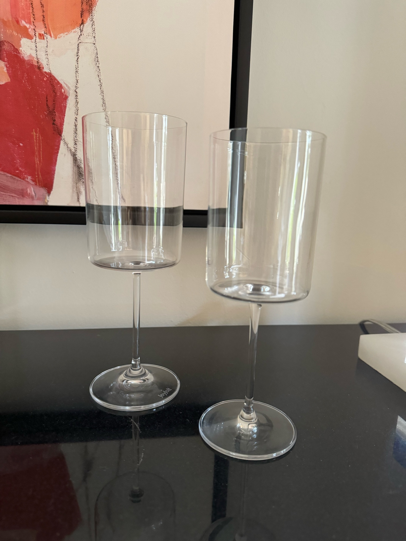 Modern wine glasses 2 sizes. 
As a veritable wine connoisseur, you’ll surely want to enjoy your favorite glass of wine from finest quality glasses. Whether for your home bar or as a treat to your guests, the JoyJolt Claire Collection of red and white wine glasses is the perfect solution!
PREMIUM CRYSTAL: This set of 2 large wine glasses is crafted with finest attention to detail from superior quality, highly durable crystal. The glasses are dishwasher safe and easy to clean
MODERN DESIGN: The Claire tall wine glasses come with an ultra-elegant, modern design, having large rims and slender stems. The crystal body is shaped like a perfect cylinder, adding a sparkly note to your favorite wine.

#LTKFindsUnder50 #LTKHome #LTKWedding