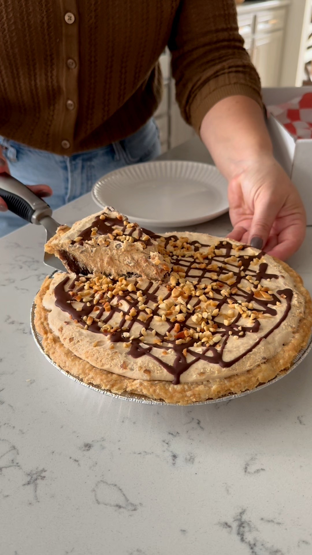This decadent Peanut Butter Fudge Pie is a must-have for your Thanksgiving spread and ships nationwide thanks to @goldbelly. Layers of peanut mousse and rich dark chocolate brownie filling are topped with Ghirardelli chocolate and crunchy peanuts. One bite and you’ll be hooked!

#ad

#LTKHome #LTKSeasonal #LTKHoliday