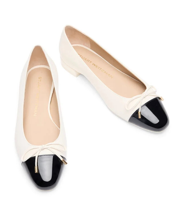 SLEEK BOW FLAT in CREAM/BLACK for Women | Stuart Weitzman® UK | Stuart Weitzman EU & UK