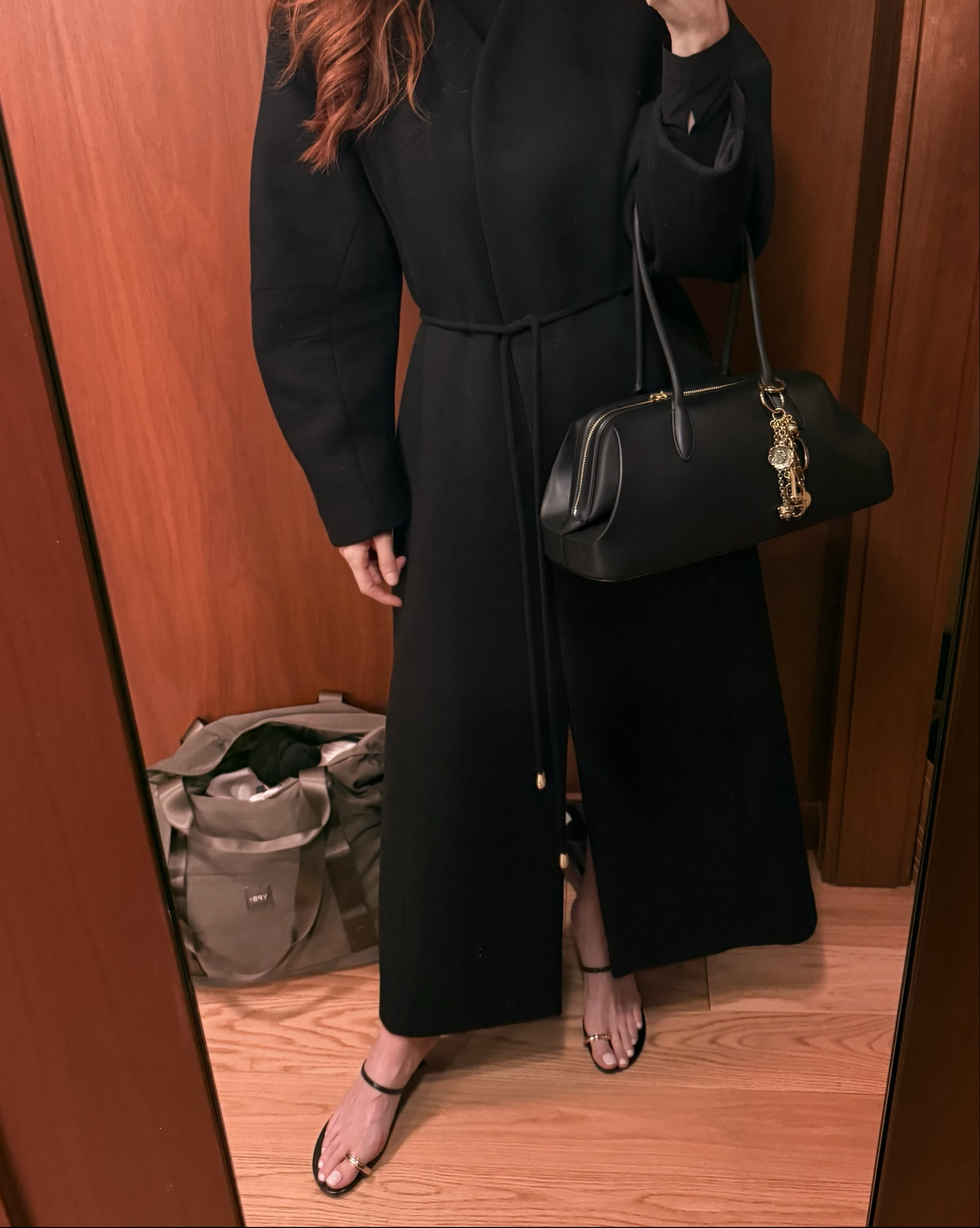 Added a few new key pieces to my fall lineup.
I’ve been looking for the perfect black coat and the long lines on this one, the structure, the barrel sleeves and the simple waist tie called to me. The length was for sure the main element here.
And I’ve been needing a larger bag with gold hardware and this one fits quite a bit. I added a new Chloe charm to it to dial it up 😁

#LTKHoliday #LTKWorkwear #LTKootd