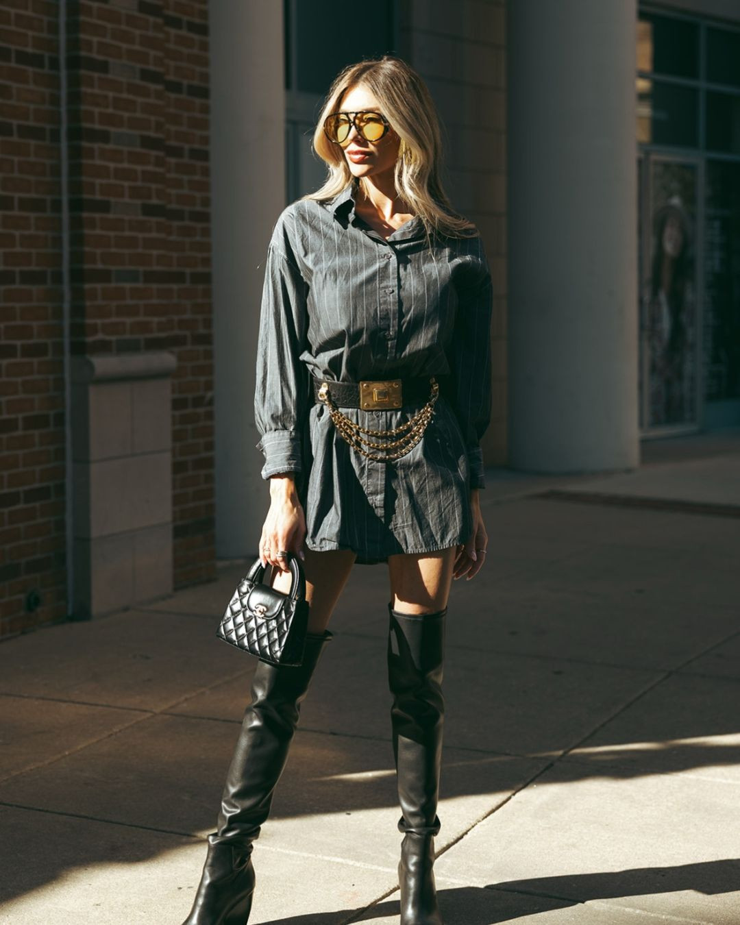 Standing on business 💼 When you mean business, but with a side of spice. My charcoal pinstripe shirt dress is Enza Costa, I linked an exact one from Poshmark and some similar looks. My AllSaints over the knee leather boots are a staple, linked similar styles from this season. My Chanel mini Kelly shopper will definitely be a bag I pass down to my daughter. My sunglasses are from Amazon and definitely give Bottega vibes. 🖤

#LTKootd #LTKFindsUnder100 #LTKdayinmylife