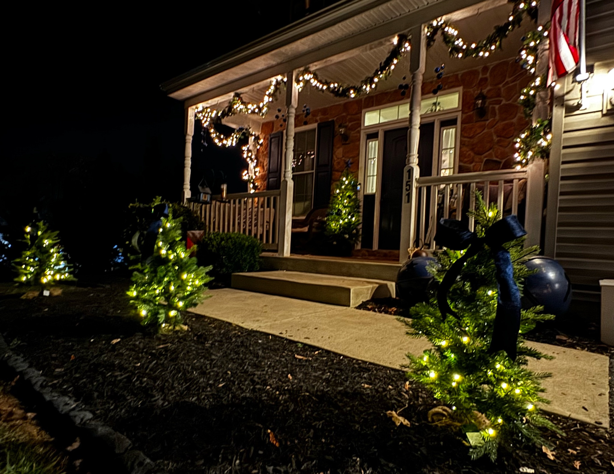 Loving my outdoor, mini-Christmas trees! Added the navy bow to tie it in to the home  

#LTKHome #LTKSeasonal #LTKHoliday