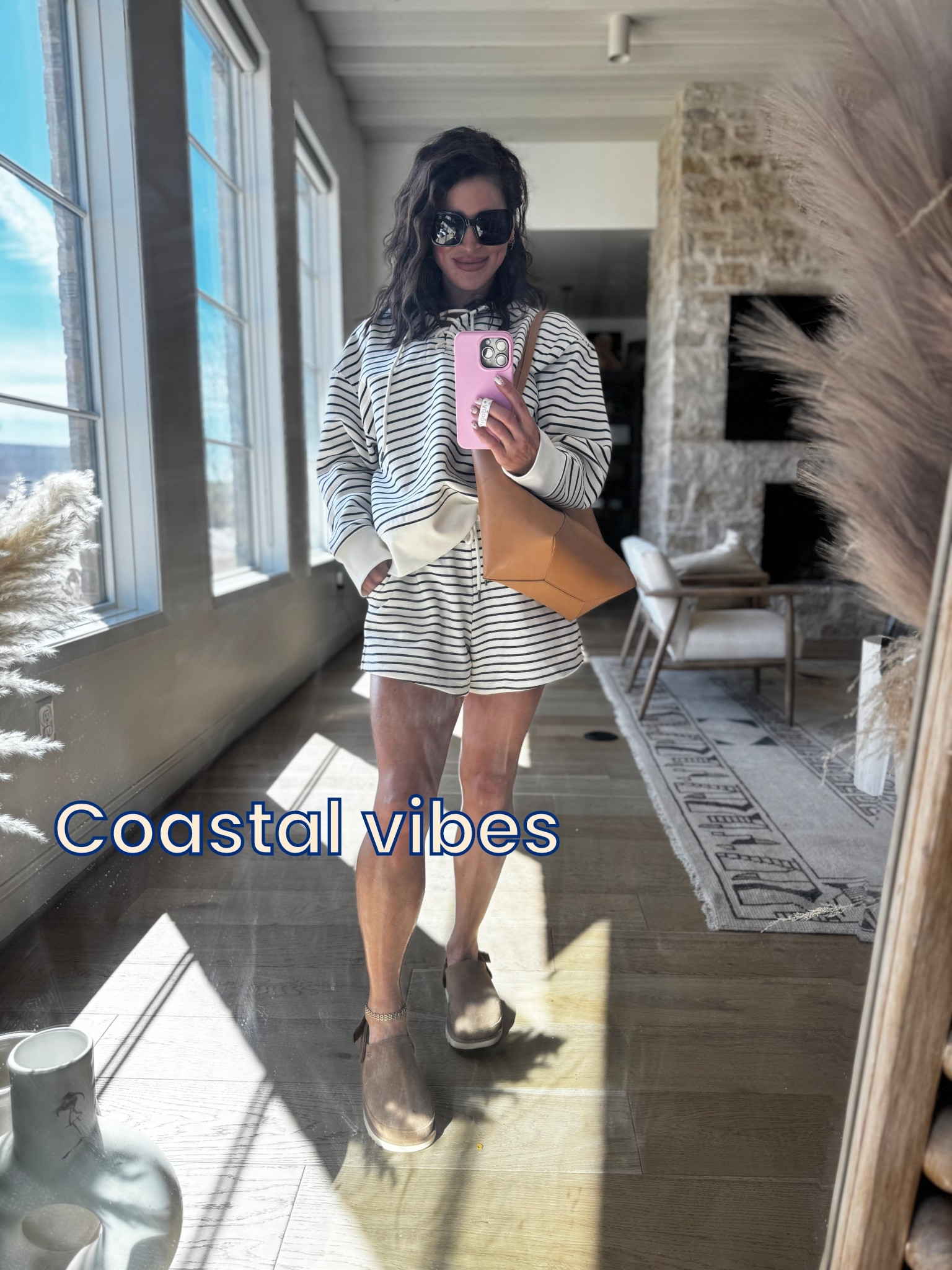 Serving coastal cool meets coffee run chic ☕️⚓️

This navy stripe tie-up hoodie is giving effortless but put together—aka my entire personality right now. Lightweight, comfy, and elevated. Paired it with matching shorts + my go-to clogs for that “casual but cute” vibe on repeat. 🤍 

#LTKootd