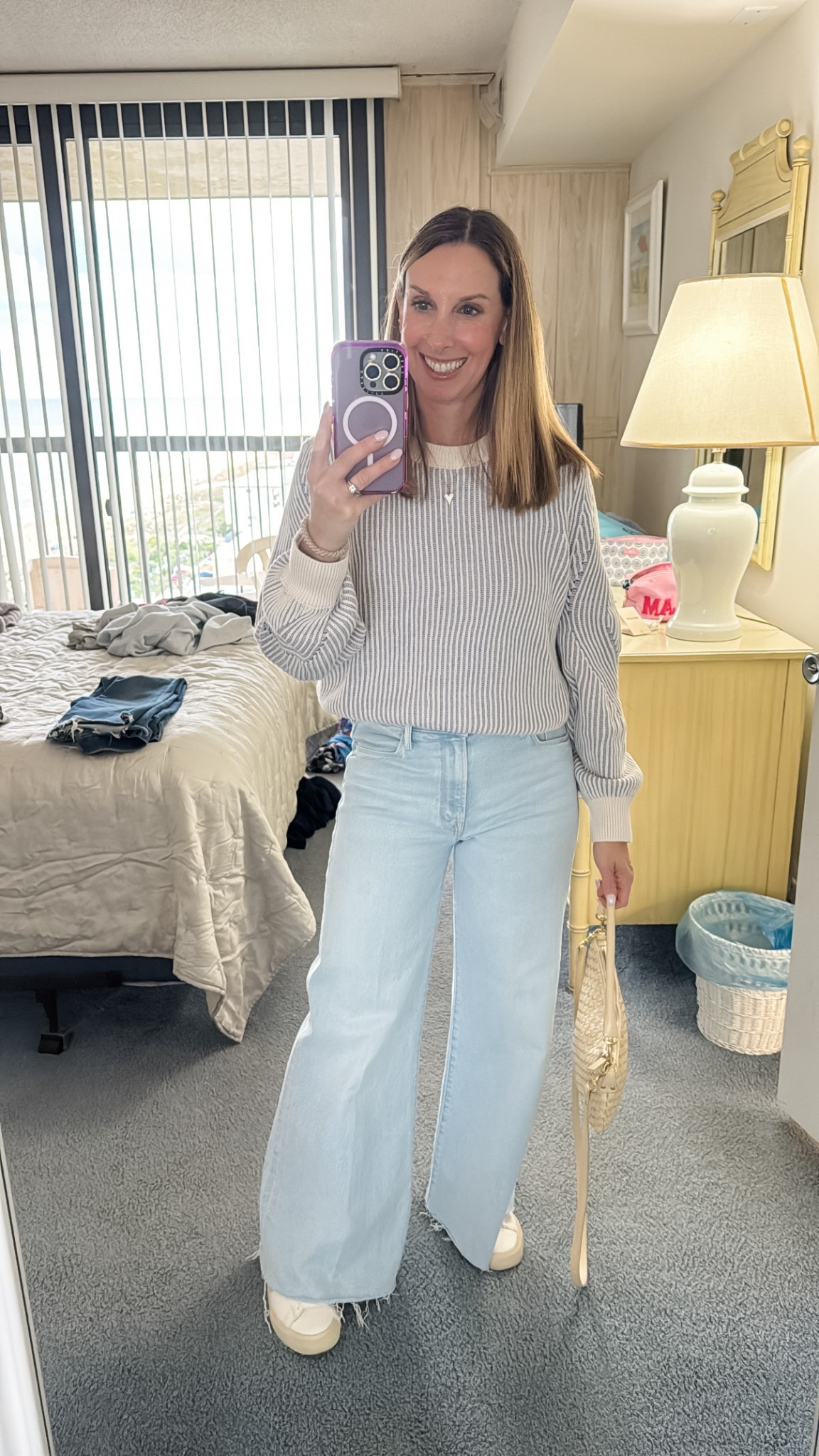 Evening outfit at the beach to sit by the water 
Mother jeans
Clare V. Bag
Splendid sweater