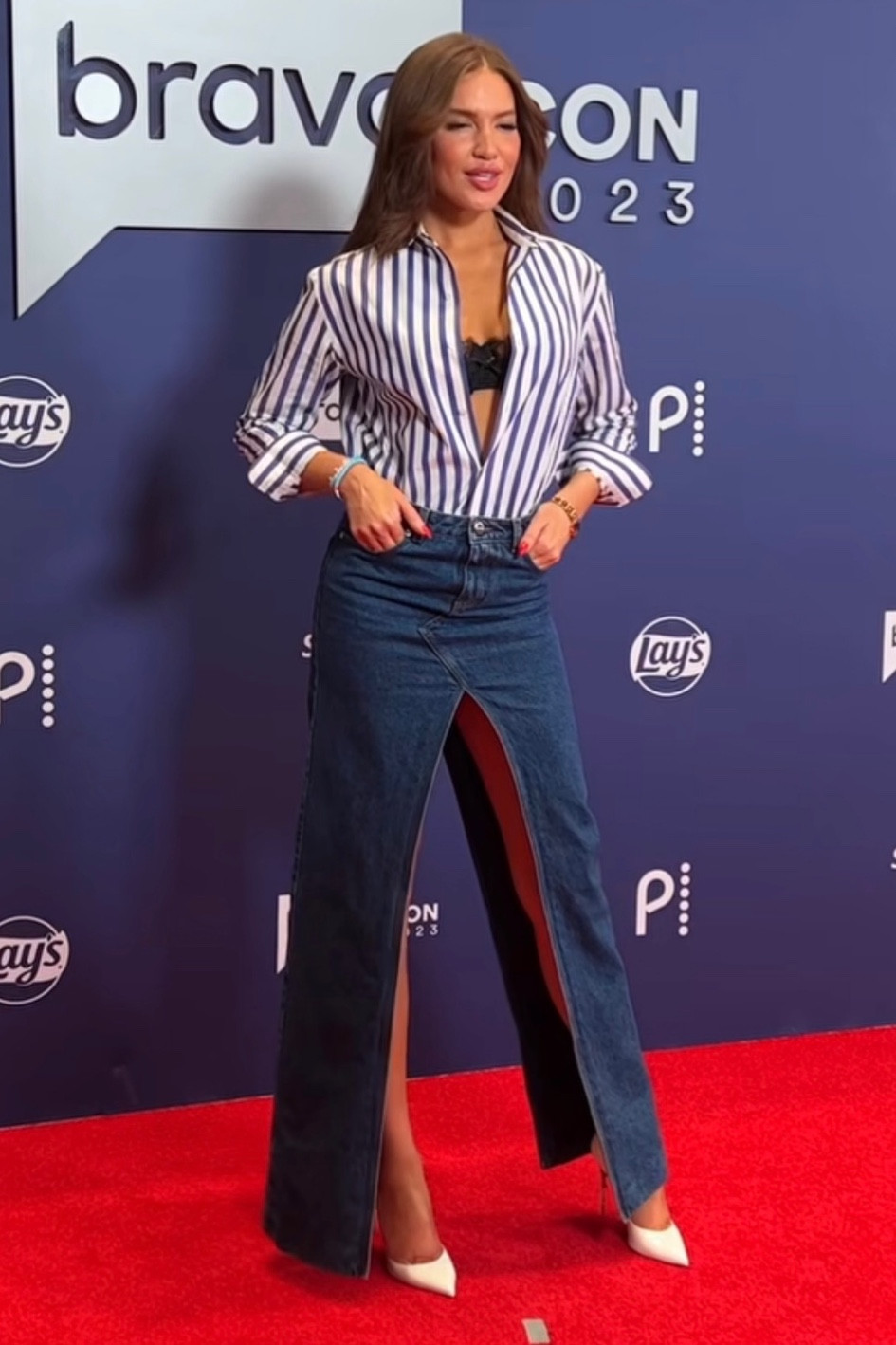 Shop Brynn Whitfields asymmetric maxi denim skirts and striped button up top #Bravocon 

#LTKstyletip #LTKworkwear