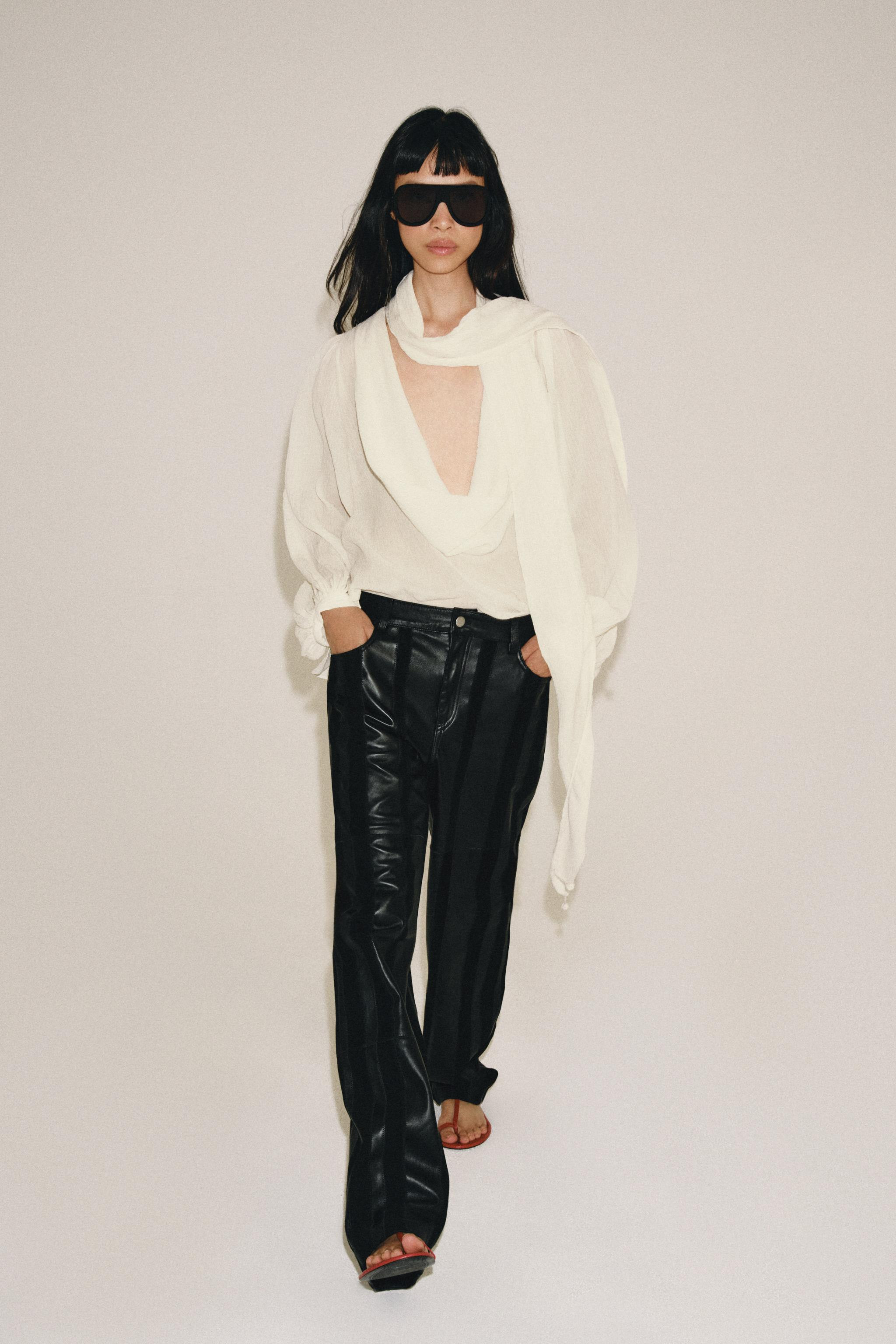 ZARA WOMAN COLLECTION. Shirt made of viscose. Fluid neckline with matching fabric tie detail and ... | Zara US