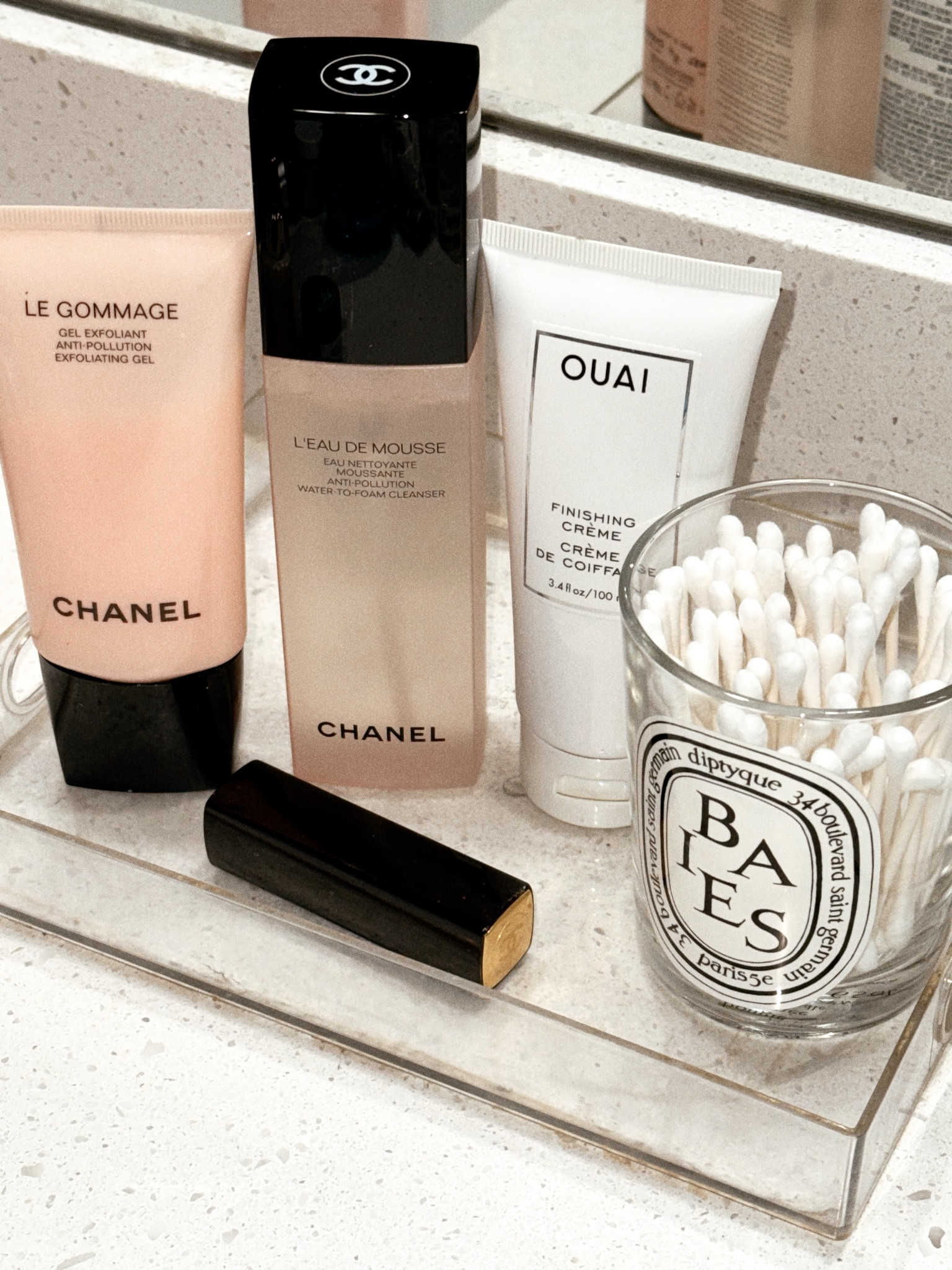 On my beauty tray 💕 Loving Chanel skincare lately such as the Le Gommage scrub, Anti-Pollution Cleanser, and lipstick. Also the #Ouai finishing Creme to get rid of frizzy static winter hair! #beautyfavs #winterbeauty #wintermakeup #diptyque #chanel 

#LTKBeauty #LTKSeasonal