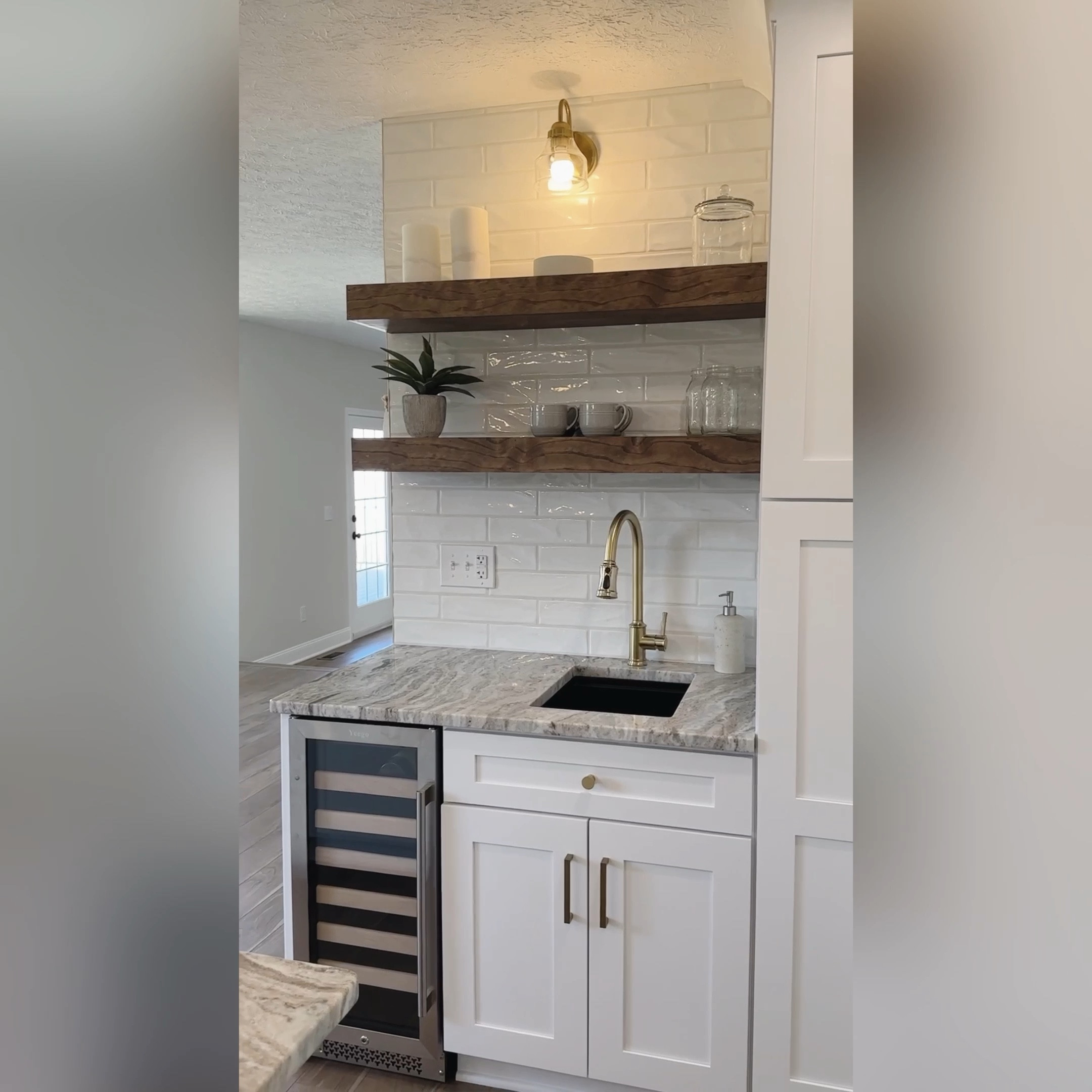 Wine fridge // floating shelves // wine cooler // butler sink // touch faucet 

#LTKunder100 #LTKFind #LTKhome