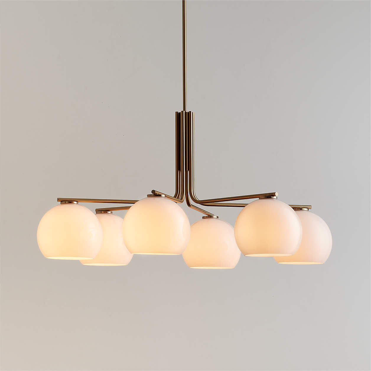 Arren Brass Chandelier Light with Round Milk Glass Shades 37.5" + Reviews | Crate & Barrel | Crate & Barrel