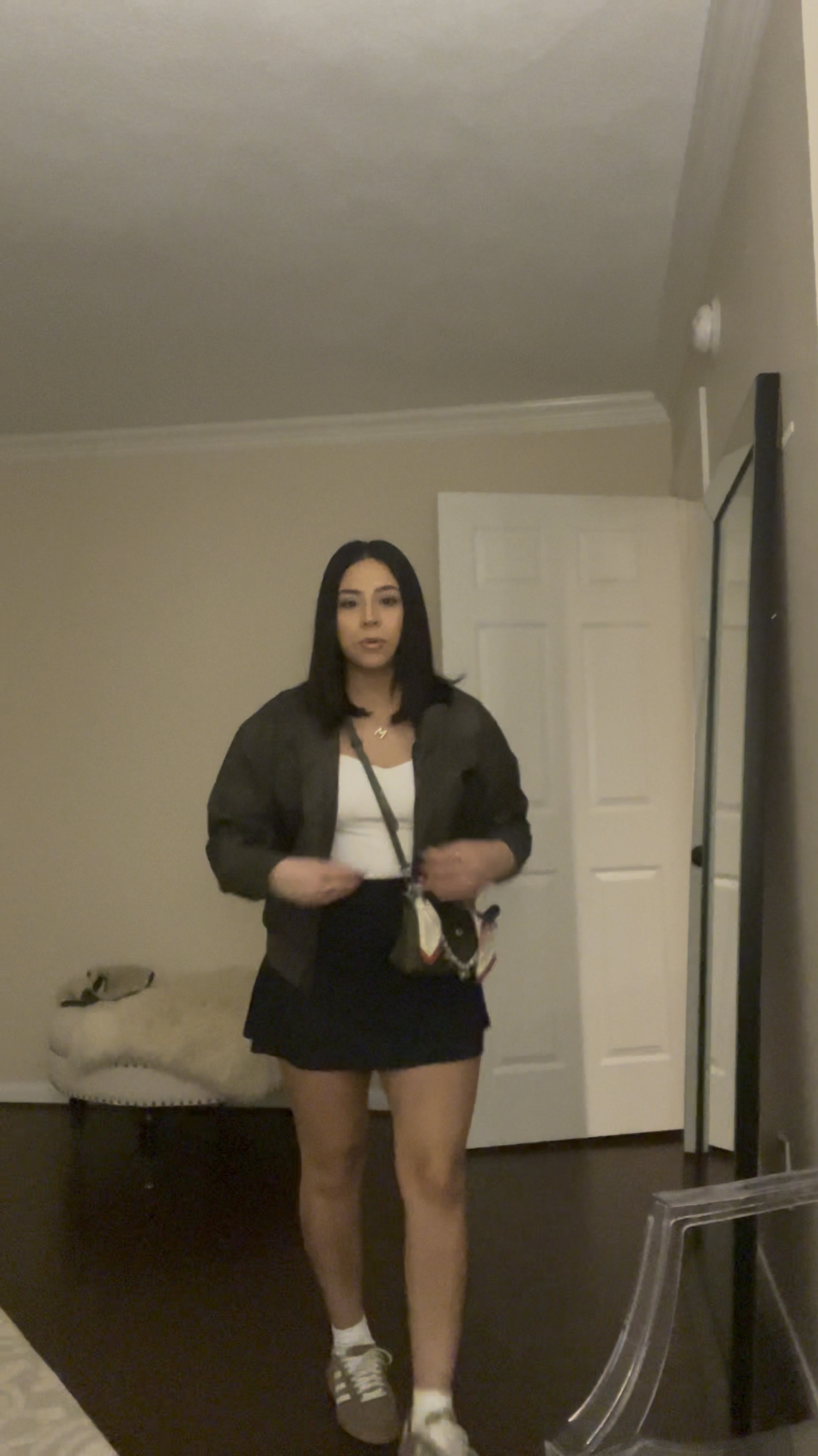 Casual dinner outfit idea 
White sweetheart neckline long sleeve: small 
Black golf skirt: small 
Brown distressed faux leather jacket: small 
Longchamp pliage mini bag 
Crossbody strap 
Purse organizer 
Silk bag scarf 
Gold bubble initial necklace 
Adidas handball spezial sneakers: 4.5 men 
Gold oura ring 

#LTKPetite #LTKStyleTip #LTKFindsUnder100